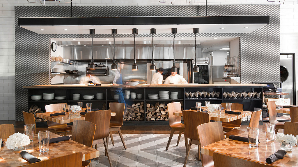 A restaurant with tables and chairs.