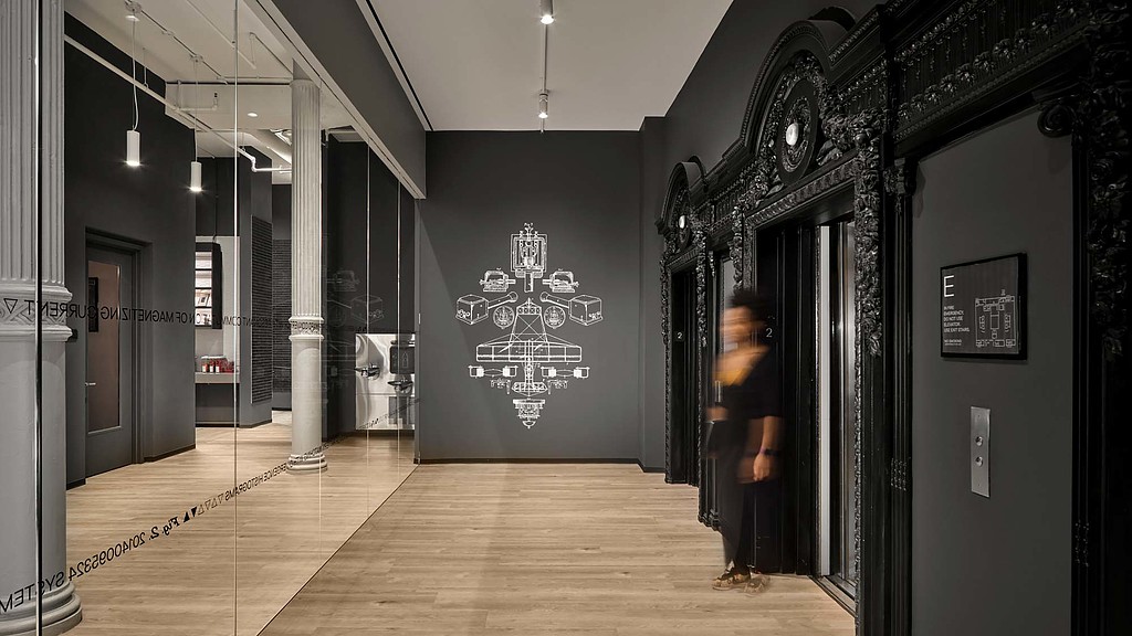 A person standing in a hallway.