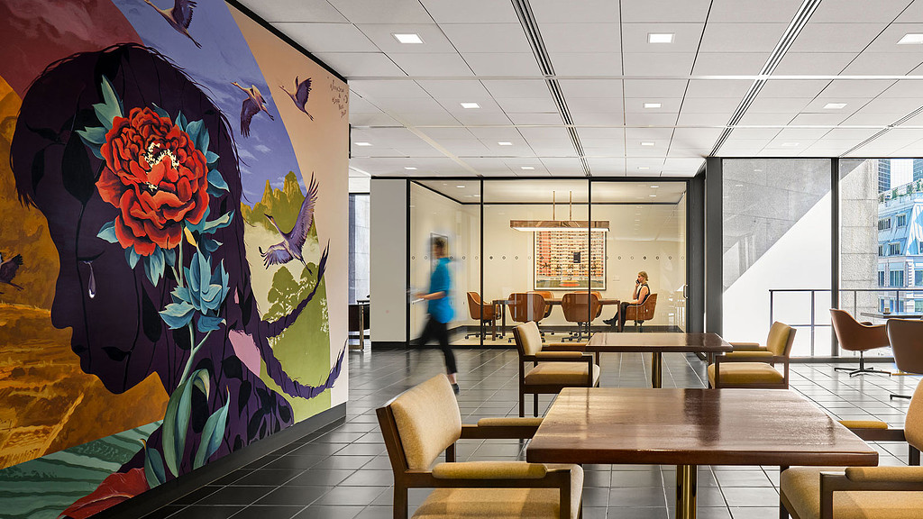 A room with tables and chairs.