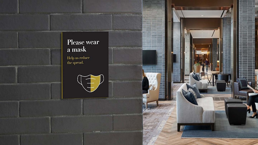 A room with a sign and chairs.