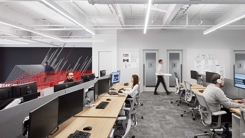 A group of people in an office.