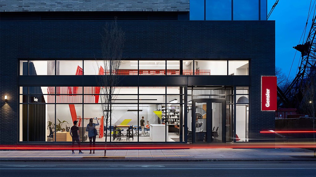 A building with a few people walking out front.