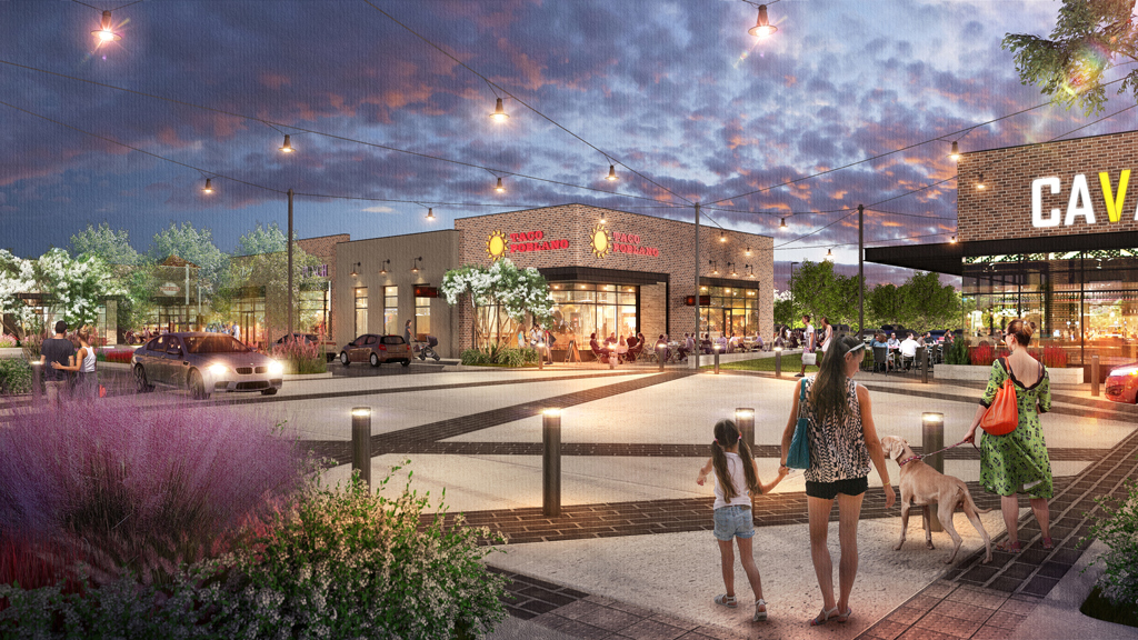 A group of people walking a dog on a sidewalk.