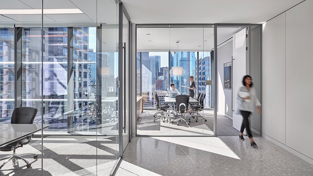 A person walking in an office.