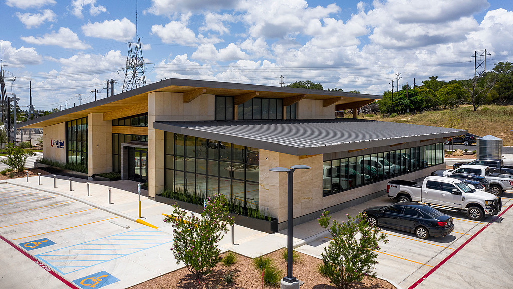 A building with cars parked outside.