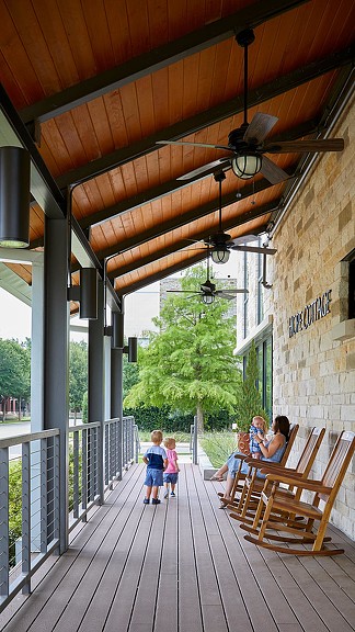 A group of people on a wooden deck.