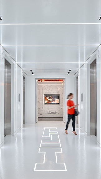 A person walking through a hallway.