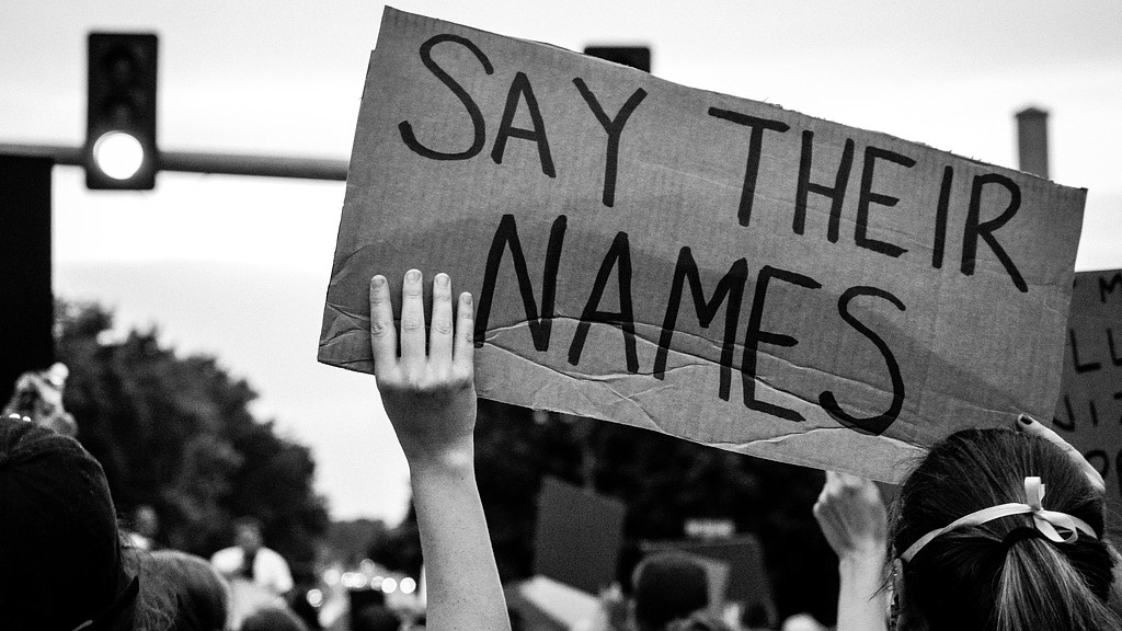 A person holding a sign.