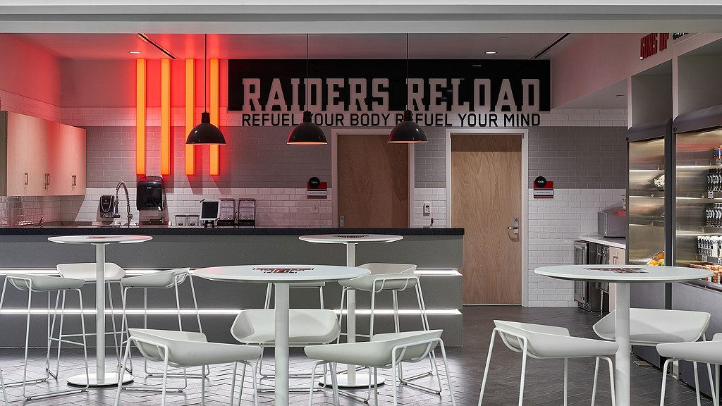 A room with tables and chairs.