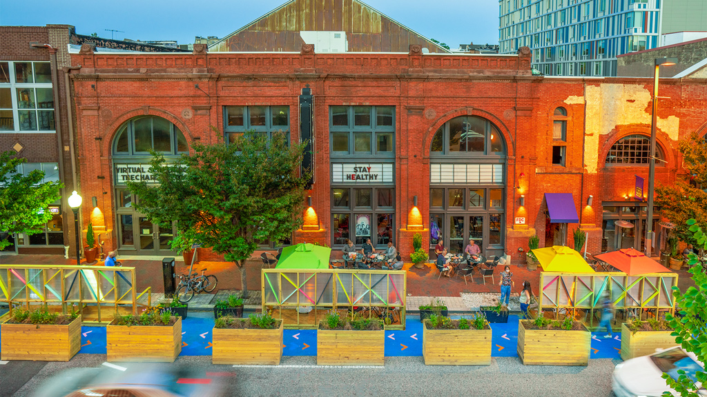 A building with a group of people outside.