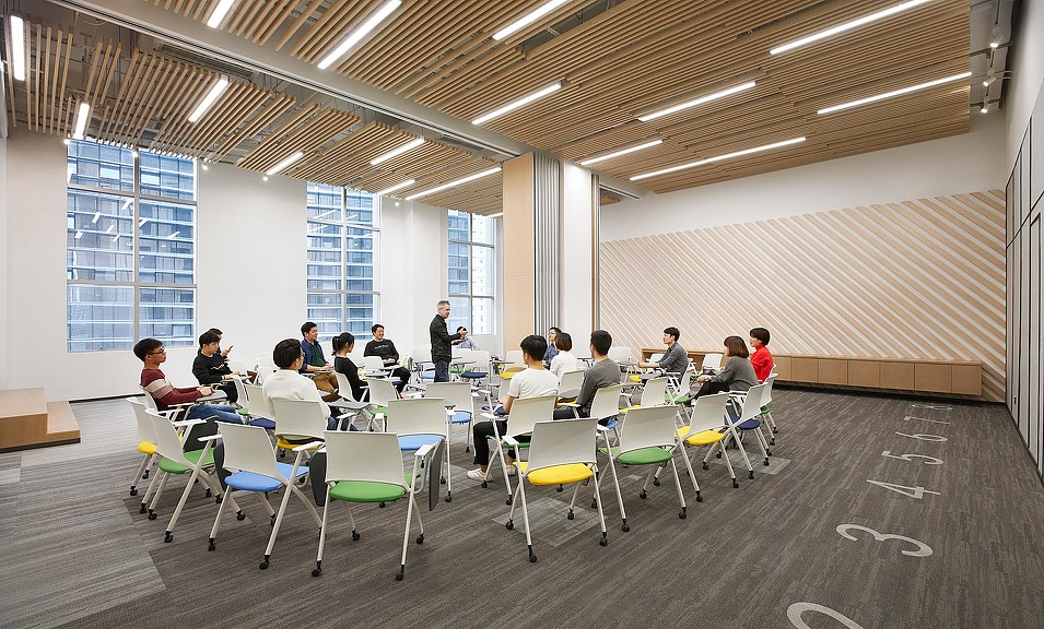 A group of people sitting in a room.
