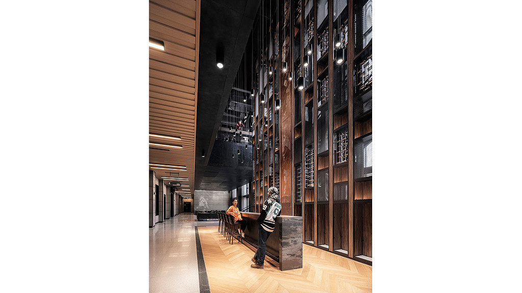 A man and woman in a library.