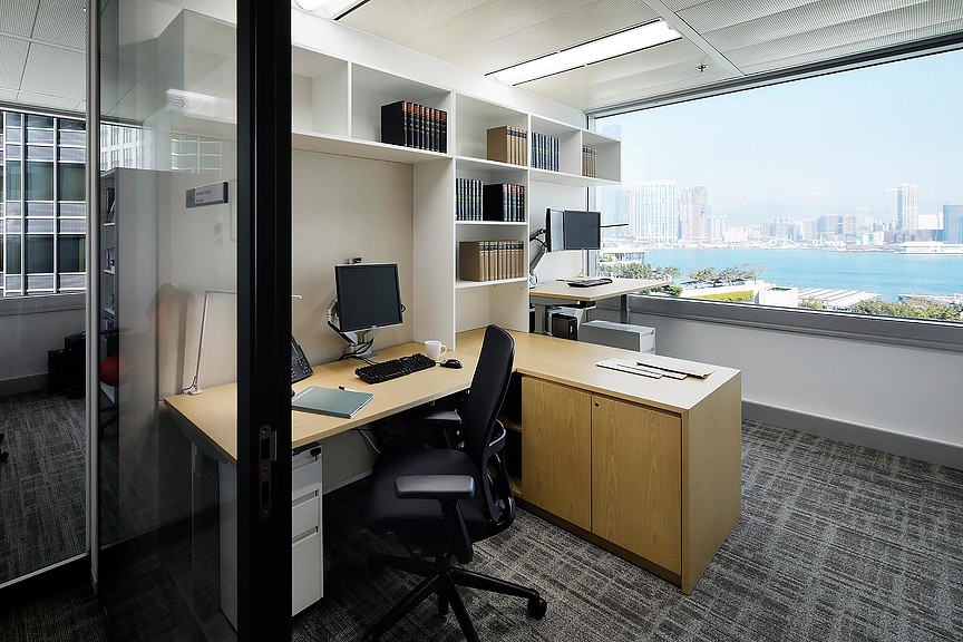 An office with a desk and a window.