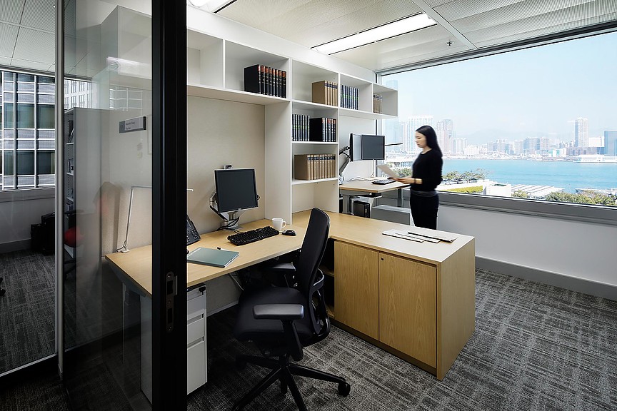 A person standing in an office.