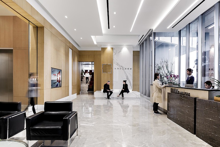 A group of people in a lobby.