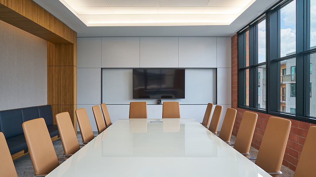 A conference room with a large table.