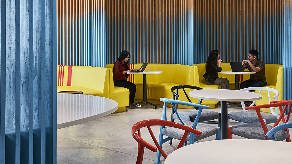 A group of people sitting at tables.