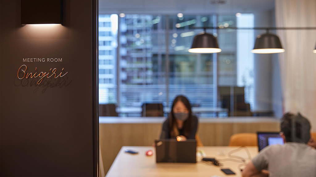 A person sitting at a desk.