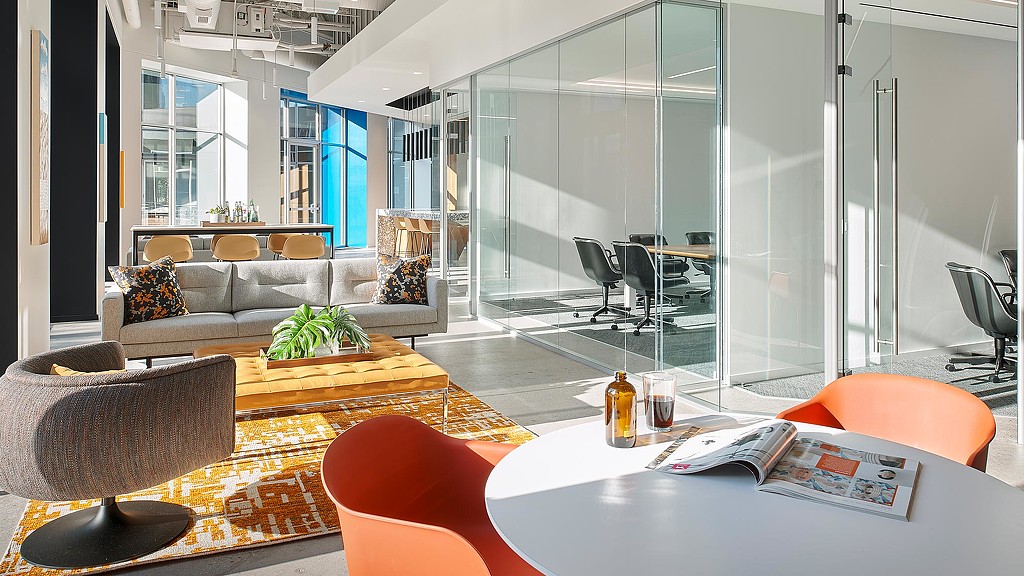 A room with a table chairs and a couch.