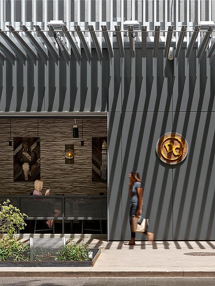 A person walking on a sidewalk.