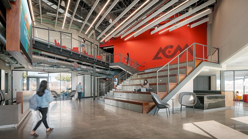 A group of people walking inside a building.