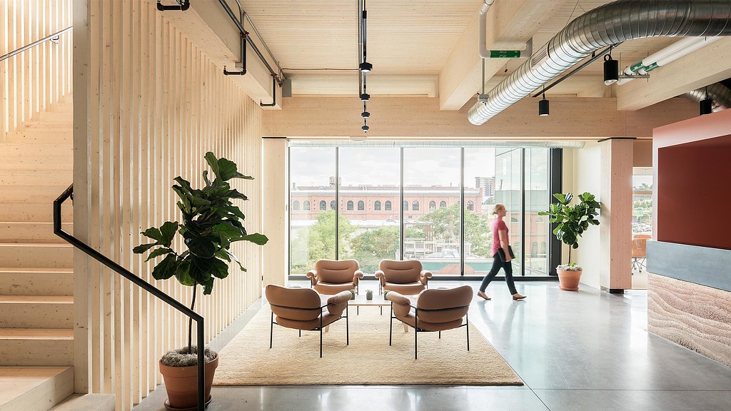 A person walking down a hall.