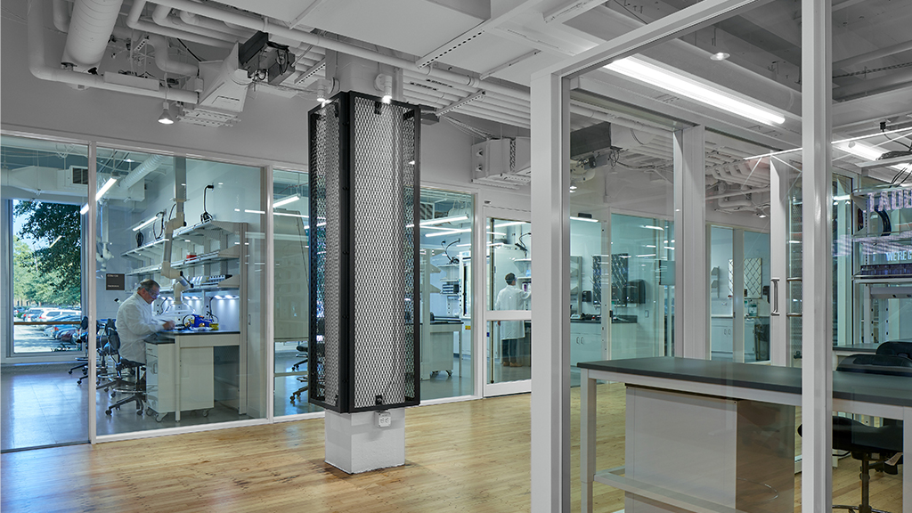 A room with glass walls and a large speaker.