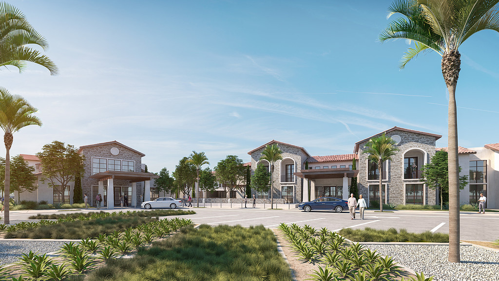 A street with palm trees and buildings.