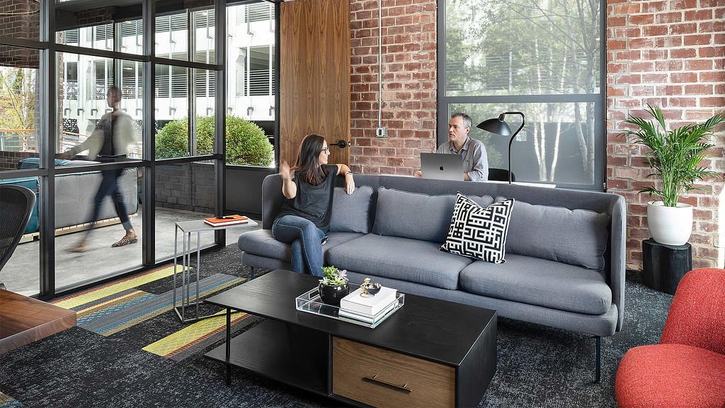 A person sitting on a couch.