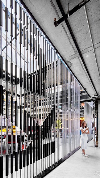 A person standing in a warehouse.