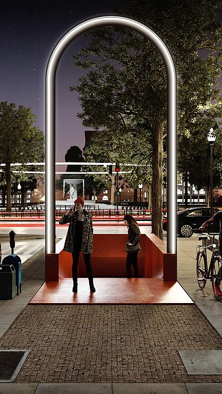 A person standing in front of a large arch.