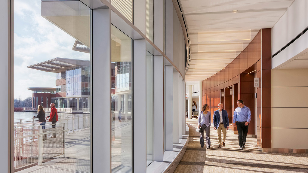 People walking in a corridor.