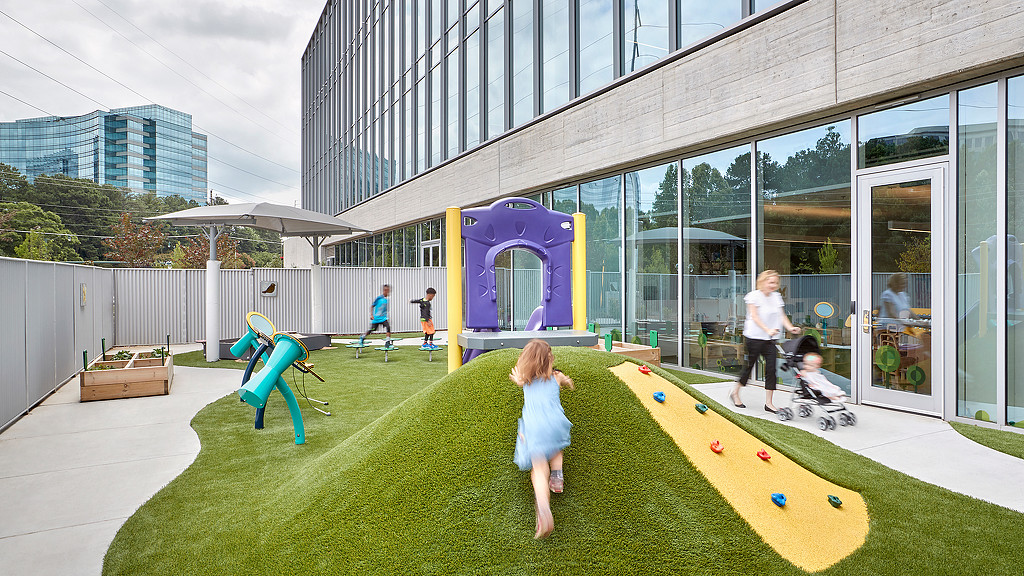 A group of people outside a building.