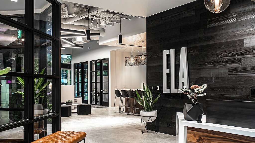 A room with glass walls and black walls.