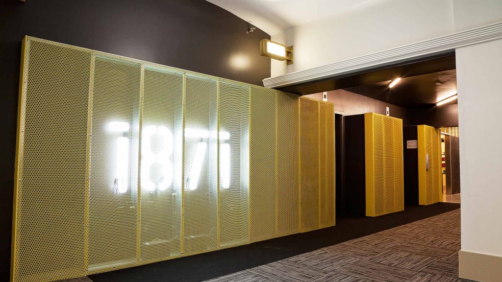 A hallway with a glass wall.