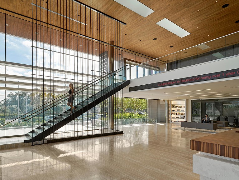 A large modern building with glass walls.
