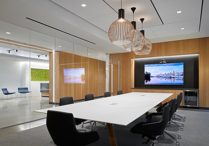 A conference room with a large screen.