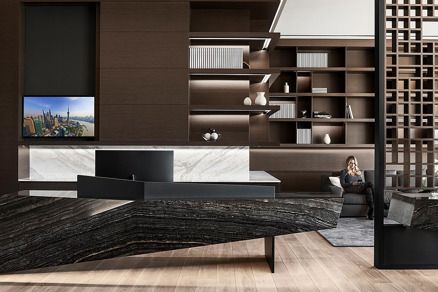 A person sitting in a chair in a library.