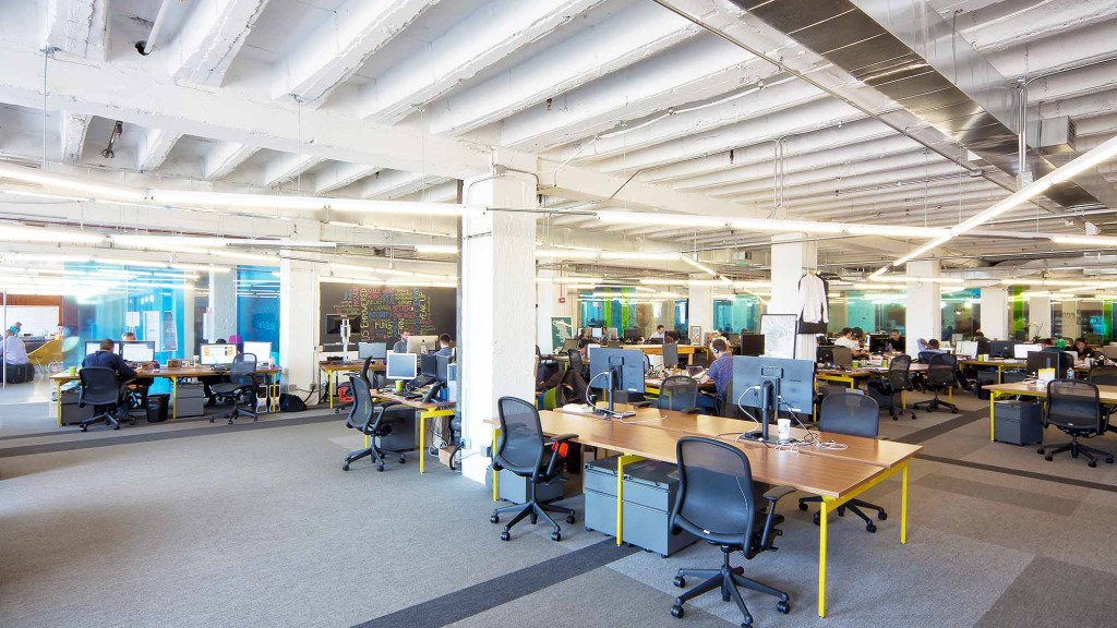 A room with tables and chairs.