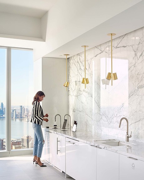 A person standing in a bathroom.