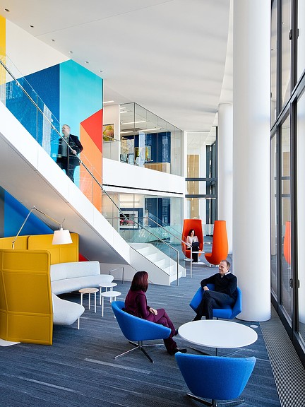 A few people sitting in chairs.