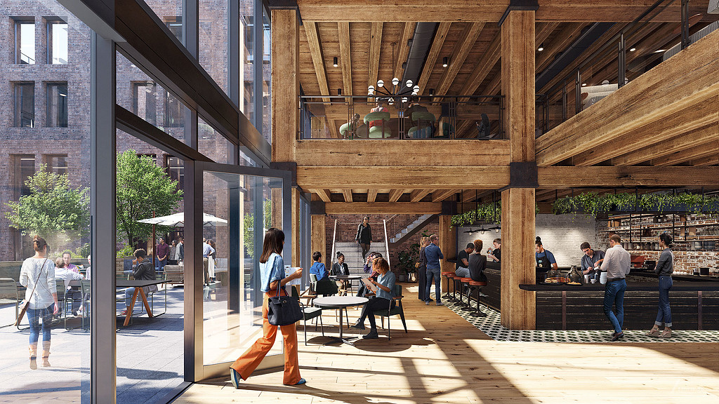 People sitting at tables in a building.