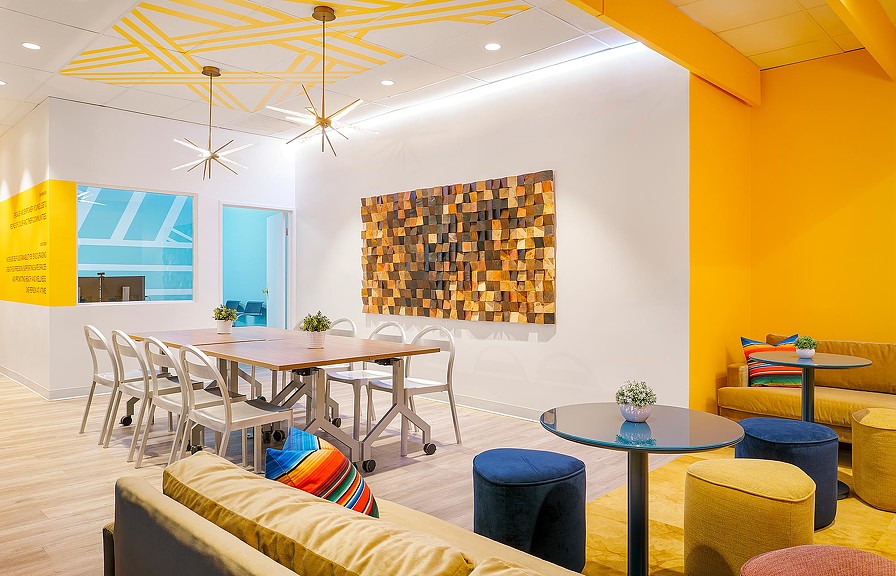 A room with tables and chairs.