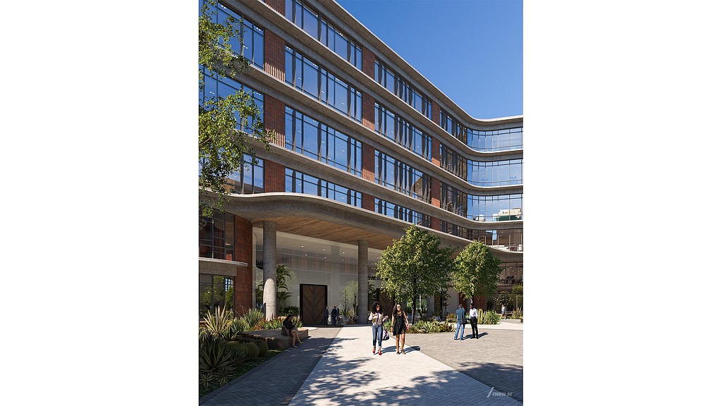 A building with a walkway and people walking around.