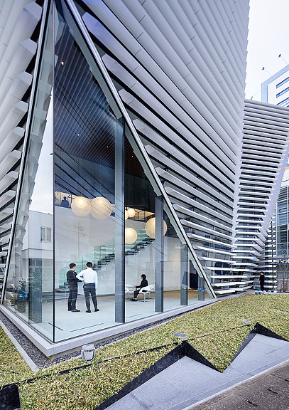 A group of people standing outside a building.