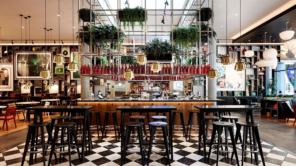 A large room with tables and chairs.