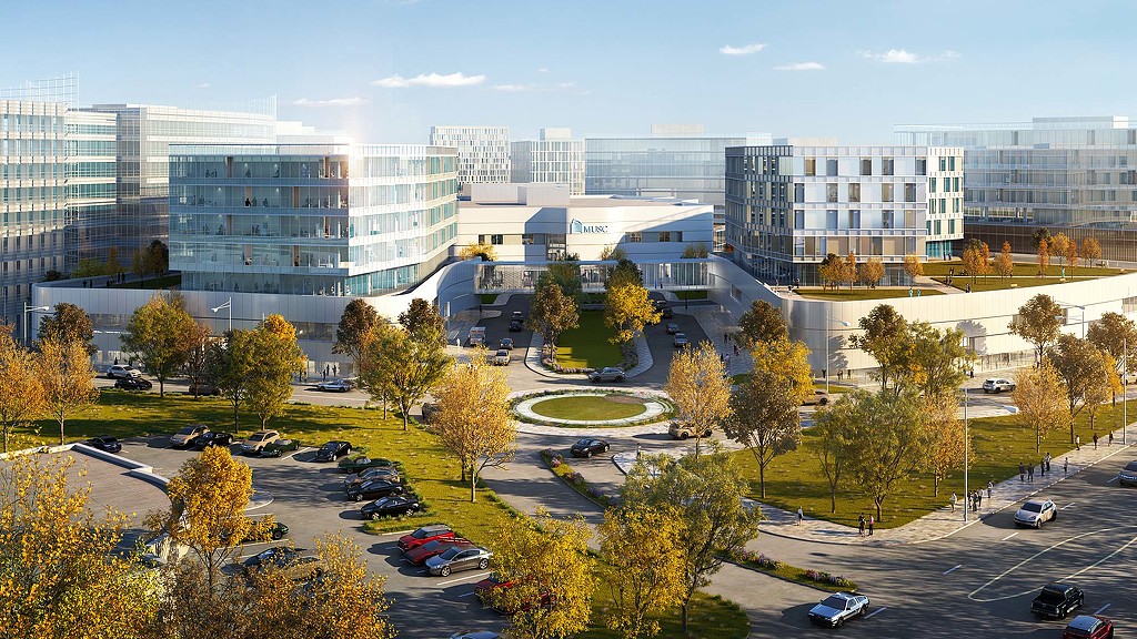 A parking lot in front of a large building.