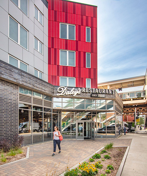 A person standing in front of a building.
