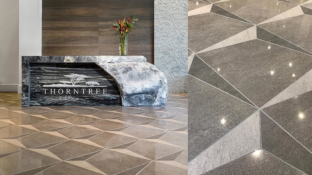 A stone fireplace with a flower in it.