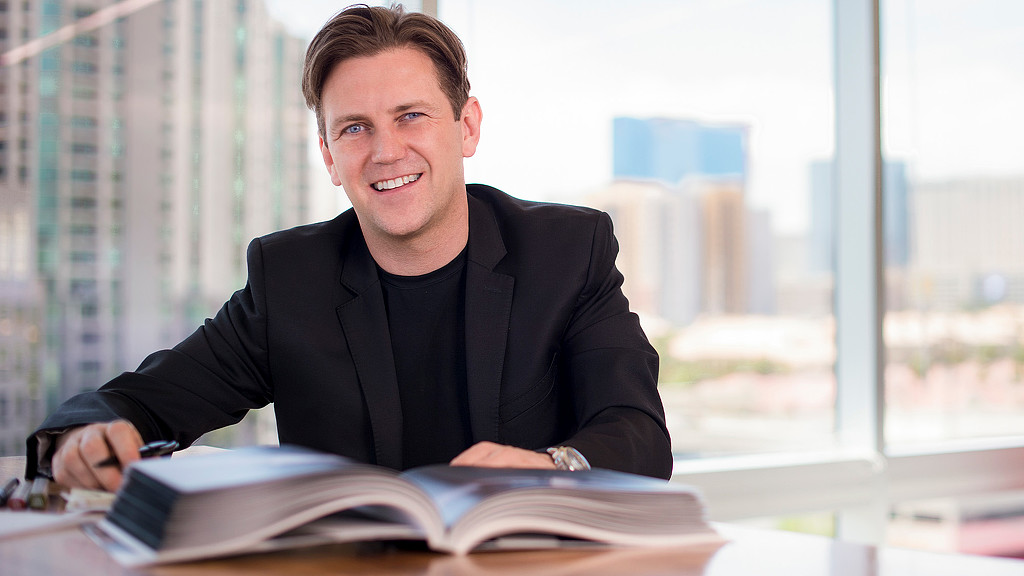 A man sitting at a desk.